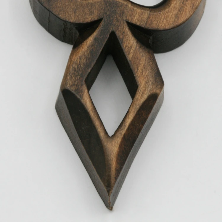 An image of a lovespoon with a symbol of a(n) Diamond.