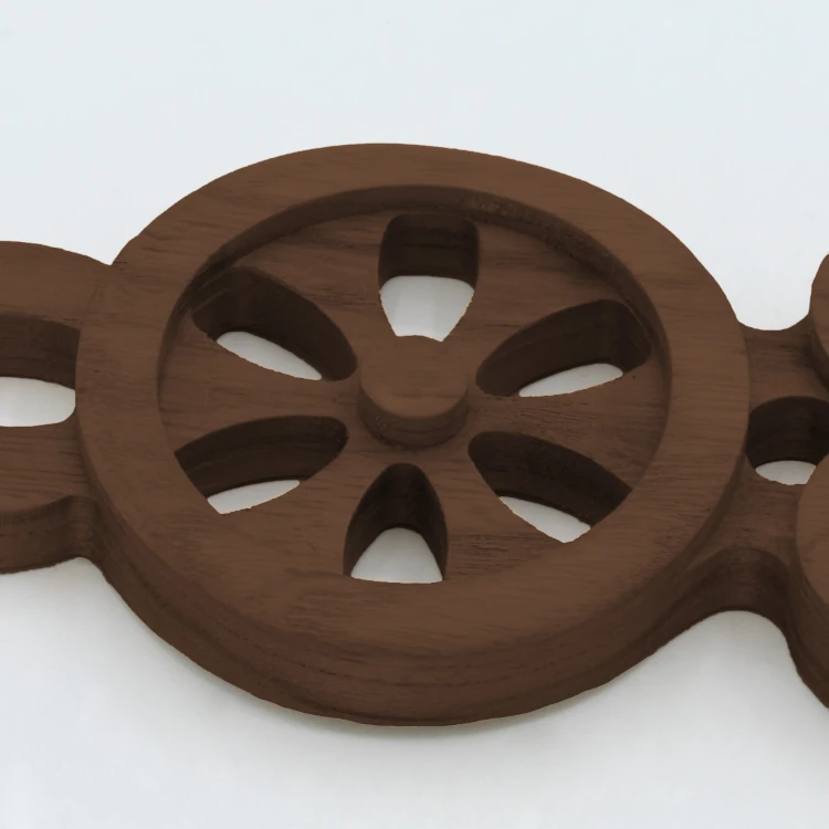 An image of a lovespoon with a symbol of a(n) Wheel.